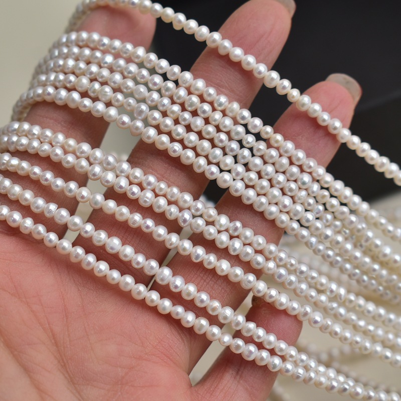 Necklaces - Natural freshwater pearls, white, 3-7mm egg-shaped